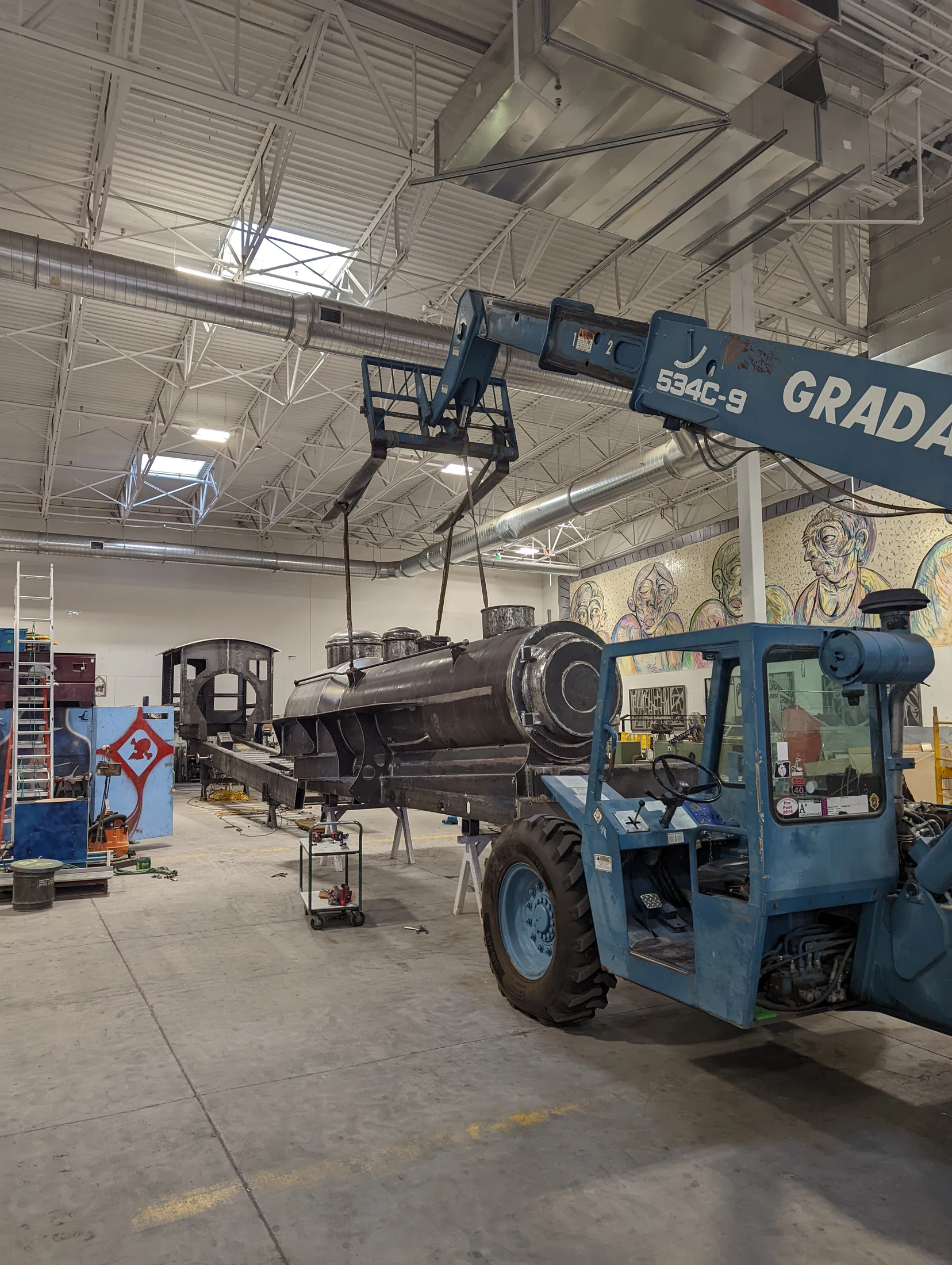 Telehandler moving Lawn Dart during fabrication